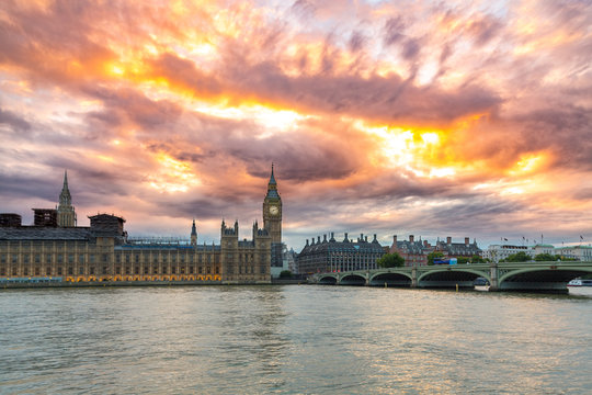 Big Ben and the Palace of Westminster, dramatic sunset sky, landmark of London, UK