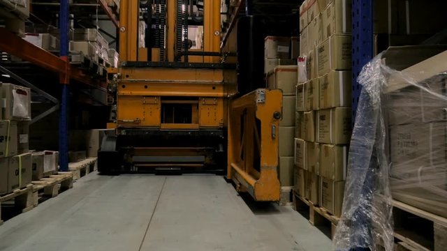 Pallet truck working in warehouse