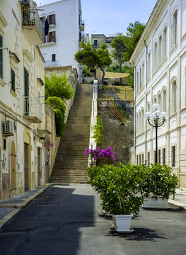 Apulia, Vieste old town, south Italy.Typical italian medieval narrow street.