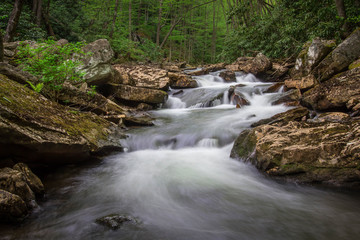 flowing stream in the Shenandoah with long exposure to slow down and flatten out the water 