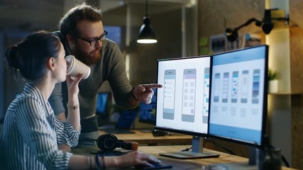 Female UX Architect Consults Male Design Engineer, They Work on Mobile Application in a Creative Office Space. Shot on RED EPIC-W 8K Helium Cinema Camera. - Powered by Adobe