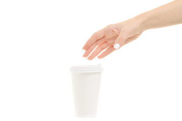 Female hands holding coffee in a cardboard glass 