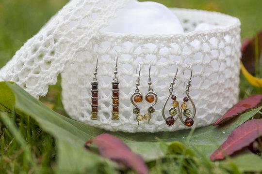 Natural resin earring on the white jewelry box