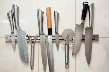 Fotobehang Set of professional knives: paring, Yanagiba, pizza knife, Santoku, carving knife, universal or chef's knife © mikhail_kayl
