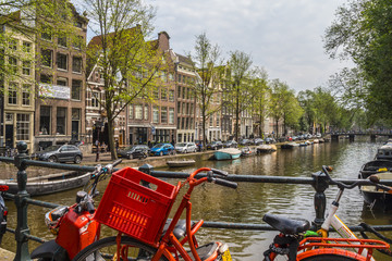 Fototapeta na wymiar The famous canals in the center of Amsterdam - AMSTERDAM - THE NETHERLANDS - JULY 20, 2017