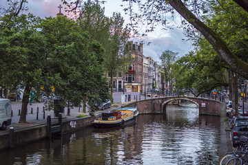 Fototapeta na wymiar The beautiful city of Amsterdam with its canals and small houses