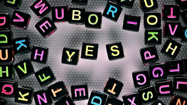 Cubes with letters have collected a word - yes