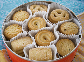 A round box of multi-shape cookies                     