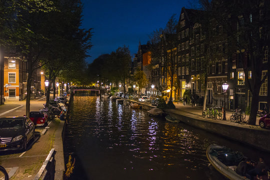 The amazing canal district in Amsterdam by night © 4kclips