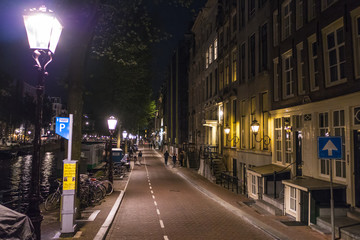 Walking through the city center of Amsterdam by night