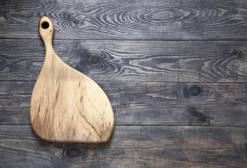 Cutting board on a wooden surface