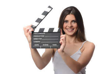 beautiful young woman with cinema clapper posing in studio. Movie concept. isolated