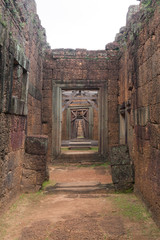 Corridor of Stone Walls to a Wood Door in Siem Reap Angkor Wat Temple Cambodia Asia