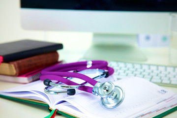 Stethoscope and computer on a desk in the office