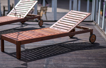 Obraz na płótnie Canvas wooden beach deck chair for relaxing