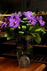 Bouquet of flowers with a dark purple orchids