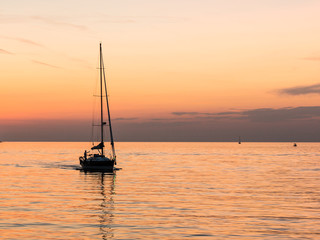 yacht with beautiful orange sea sunset