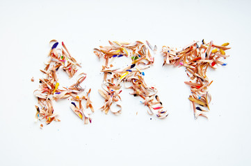 A lot of colored sawdust on the table,