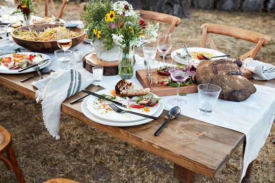 Messy table of food after a Farm To Table dinner party