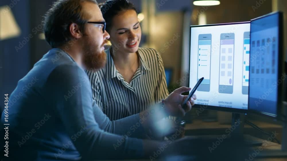 Poster handsome male and beautiful female mobile application designers test and discuss new app features. t