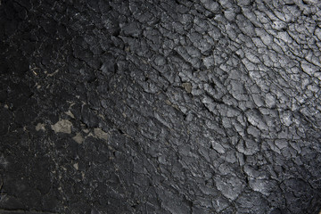 Closeup of old flaking black bonded leather chair