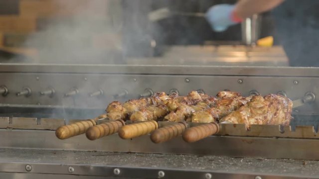 Tasty shish kebab on a grill. Summer street food festival.