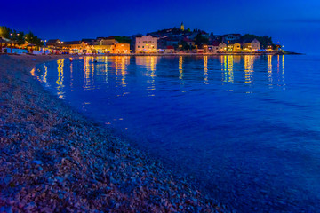 Primosten night beach view. / Scenic night view at Primosten coastal town, Croatia.