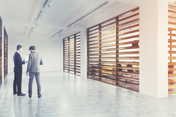 White and wood wall company lobby, side, men