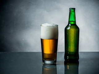 Composition of beer glass and some bottles