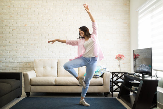 Single Woman Dancing In The New Apartment