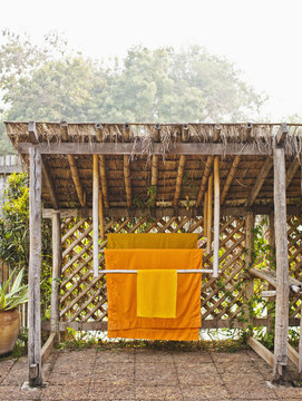 Monk robes hang in the private garden of Room #506, La Residence Phou Vao. Luang Prabang, Laos.