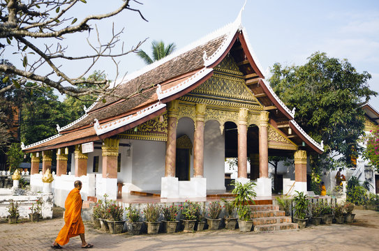 A Monk Walking By Vat Sop Sickharam. Luang Prabang, Laos.