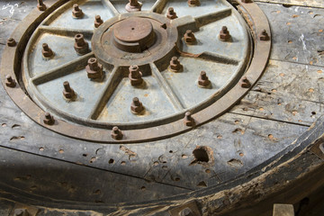 Fototapeta na wymiar Close up of wooden machinery wheel