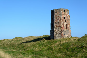 Fototapeta na wymiar Old stone watchtower