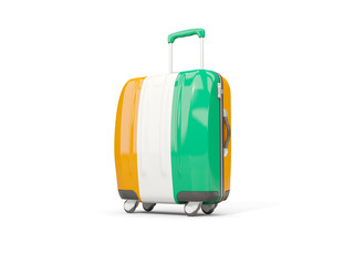 Obraz premium Luggage with flag of cote d Ivoire. Suitcase isolated on white