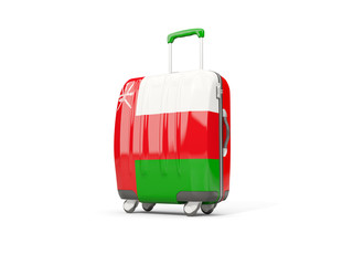 Luggage with flag of oman. Suitcase isolated on white