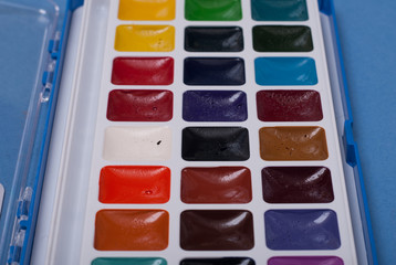 Palette of watercolor paints close up, the paint for drawing