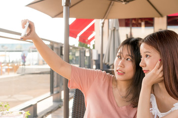 tow girls  making selfie