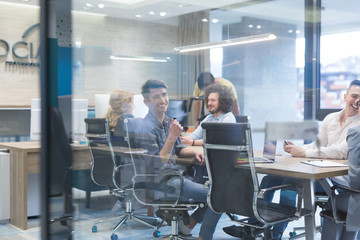 Startup Business Team At A Meeting at modern office building