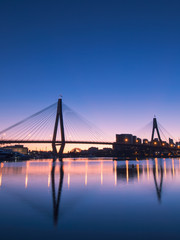 Blue hour at Anzac bridge with its reflection, Sydney, Australia.