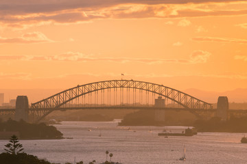 Sydney Harbour Bridge view in warm sunset time.