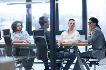 Startup Business Team At A Meeting at modern office building