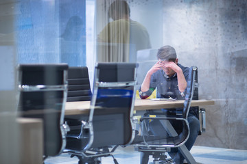 young businessman relaxing at the desk