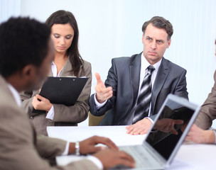 Fototapeta premium businessman holds working meeting with employees