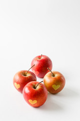 Red apples with a heart symbol