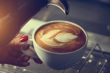 barista making coffee