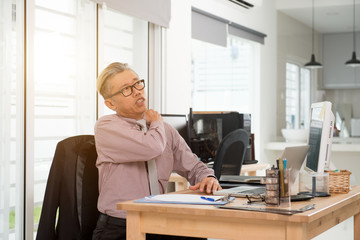 asian senior business man shoulder pain