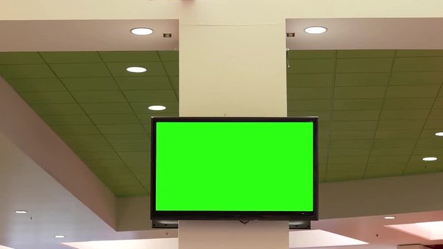 Motion of green screen tv for your ad on wall at food court area inside Coquitlam shopping mall 