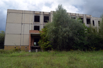Fototapeta na wymiar Abandoned Soviet school building construction site.Abandoned at 1991,during ukrainian undependence crisis 