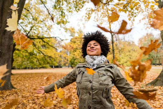 Smiling woman enjoying fall season